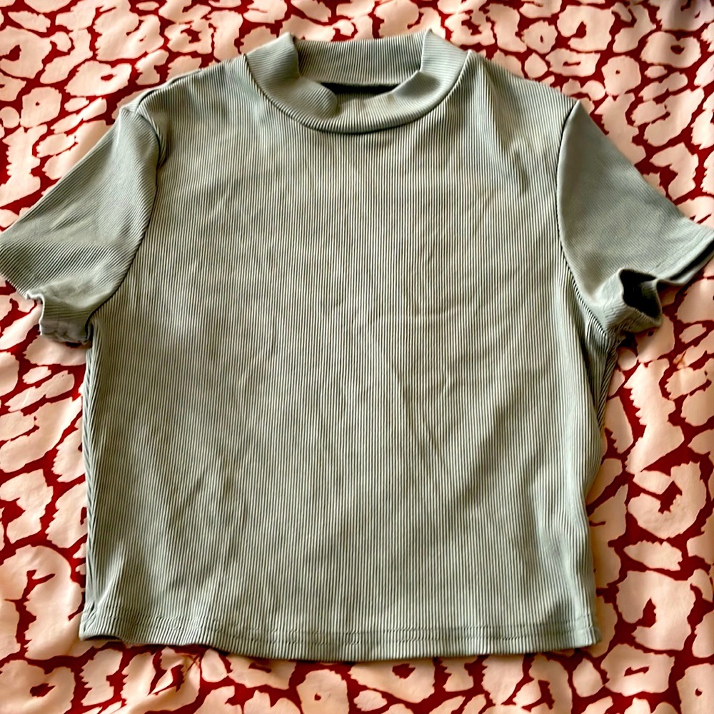 Green short turtle neck kinda of shirt